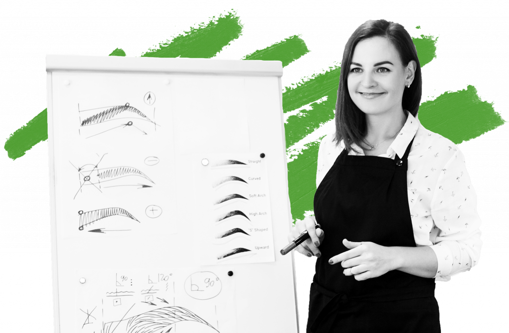 permanent makeup artist smiling with green smudge behind